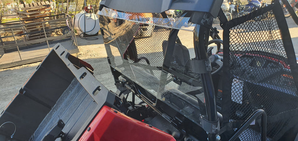 Honda Pioneer 520 rear windshield viewed from the cargo bed at an angle.
